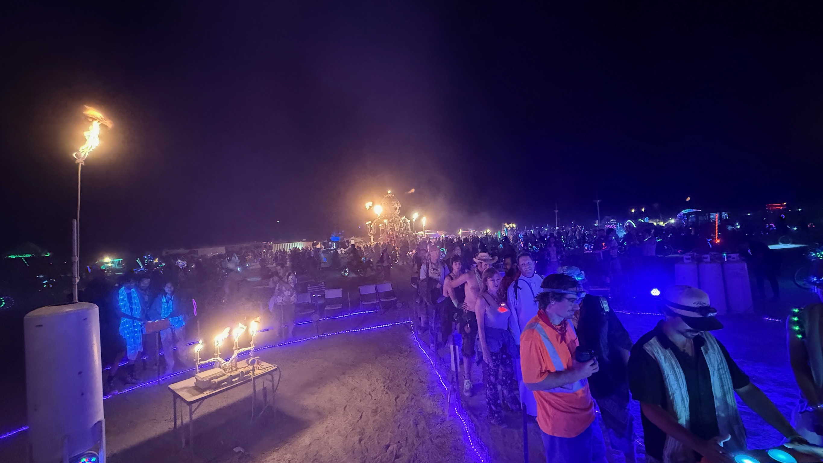 Wide view of the Nova crowd showing the full assembly of participants gathered around the installation